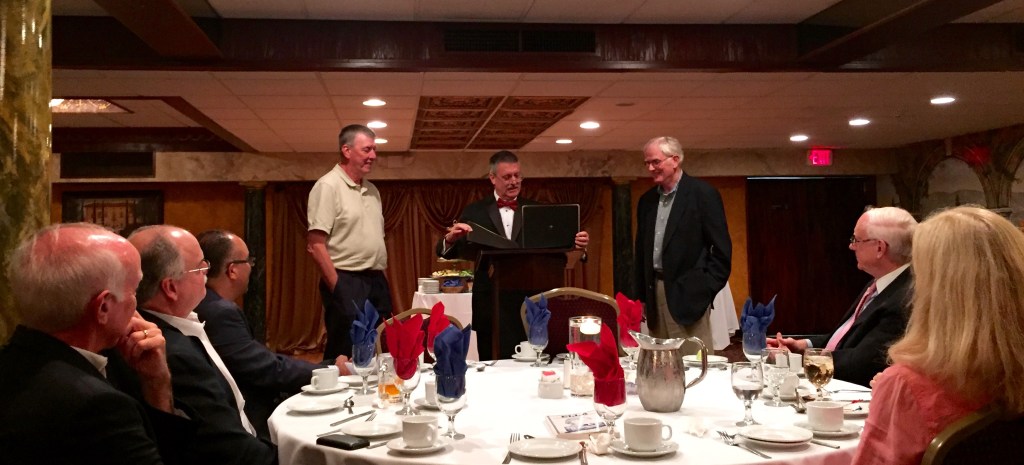 Honorees Barry Stearns and Robert Lessard listen as BDTC chair John Toomey reads a proclamation.
