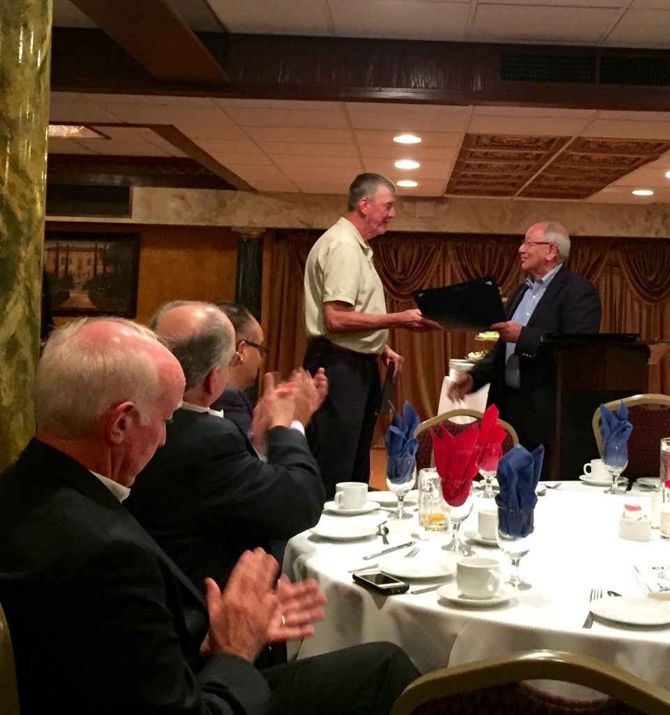 State Senator Steve Cassano congratulates Barry Stearns.
